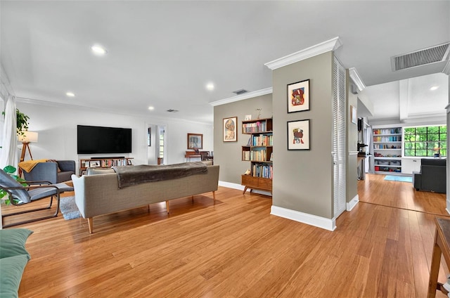 1202 Marshall Ct, Eustis, FL 32726 - living room featuring ornamental molding, recessed lighting, light wood-style flooring, and baseboards