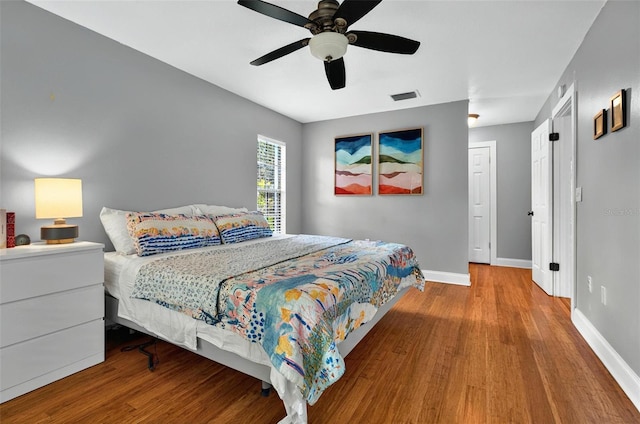 1202 Marshall Ct, Eustis, FL 32726 - bedroom featuring wood finished floors, baseboards, and ceiling fan