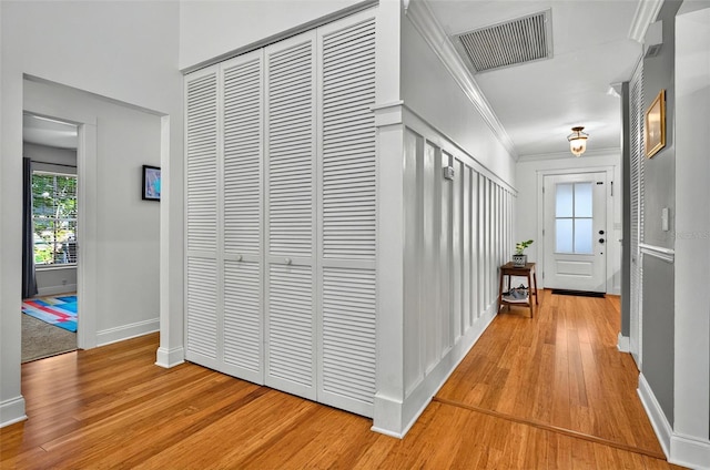 1202 Marshall Ct, Eustis, FL 32726 - hallway with light wood-type flooring, baseboards, and crown molding