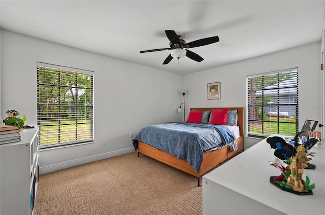 1202 Marshall Ct, Eustis, FL 32726 - bedroom with multiple windows, light colored carpet, baseboards, and a ceiling fan