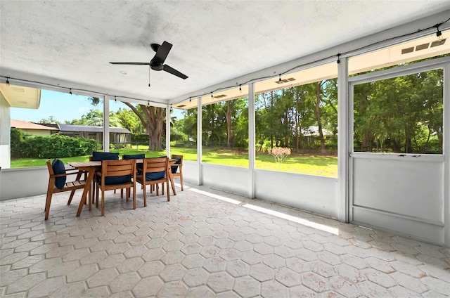 1202 Marshall Ct, Eustis, FL 32726 - sunroom / solarium with ceiling fan and outdoor dining area