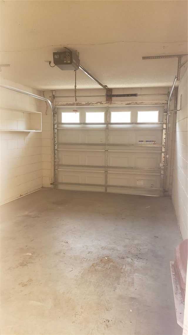 706 Lighthouse Ct, Altamonte Springs, FL 32714 - garage with a garage door opener and concrete block wall