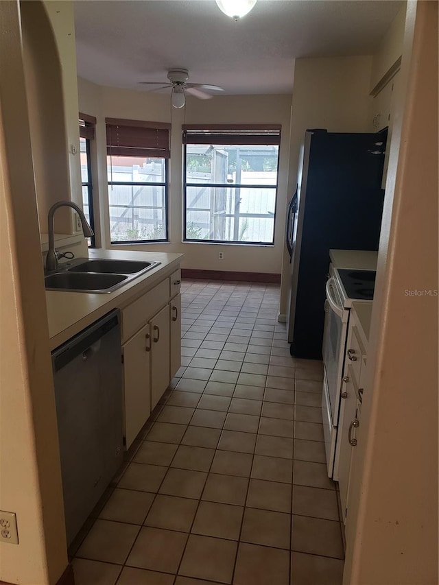 706 Lighthouse Ct, Altamonte Springs, FL 32714 - kitchen featuring dishwasher, a sink, white electric range, white cabinets, and light countertops
