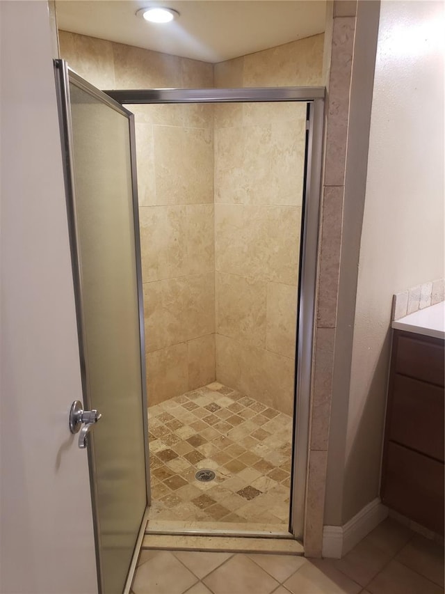 706 Lighthouse Ct, Altamonte Springs, FL 32714 - bathroom featuring a shower stall, tile patterned flooring, and vanity