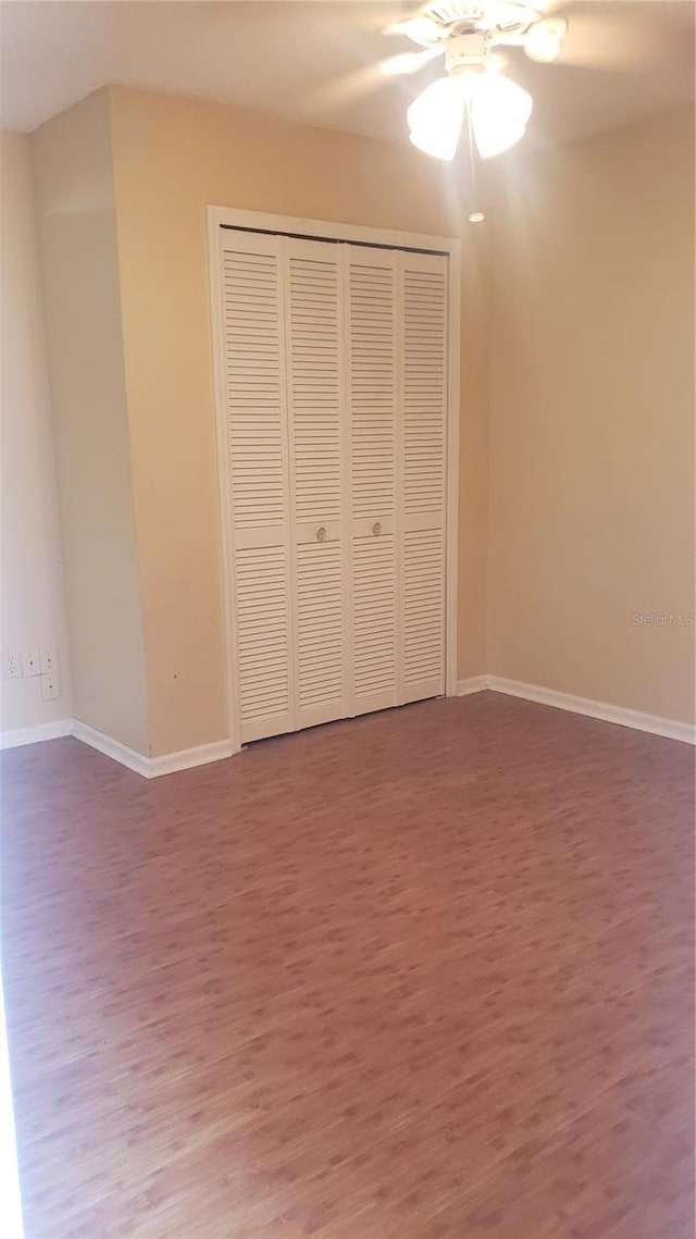 706 Lighthouse Ct, Altamonte Springs, FL 32714 - unfurnished bedroom featuring wood finished floors, baseboards, a closet, and a ceiling fan