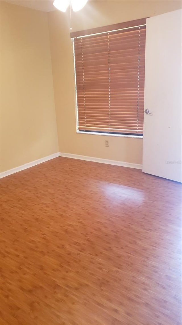 706 Lighthouse Ct, Altamonte Springs, FL 32714 - unfurnished room with wood finished floors, a ceiling fan, and baseboards