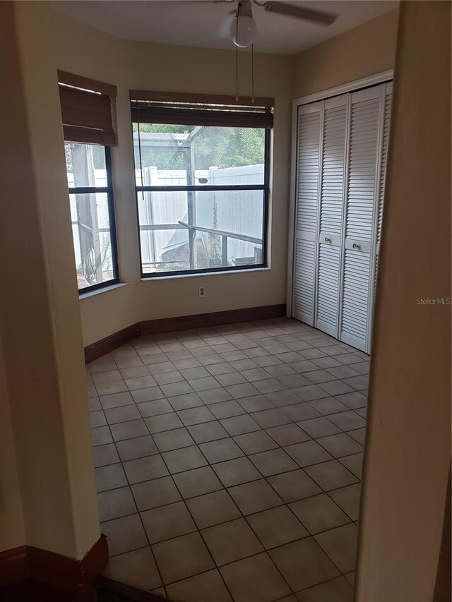 706 Lighthouse Ct, Altamonte Springs, FL 32714 - unfurnished bedroom featuring multiple windows, a closet, light tile patterned flooring, and baseboards