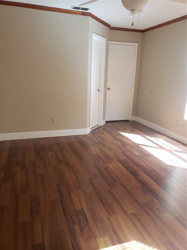 706 Lighthouse Ct, Altamonte Springs, FL 32714 - spare room with crown molding, dark wood-style floors, and baseboards