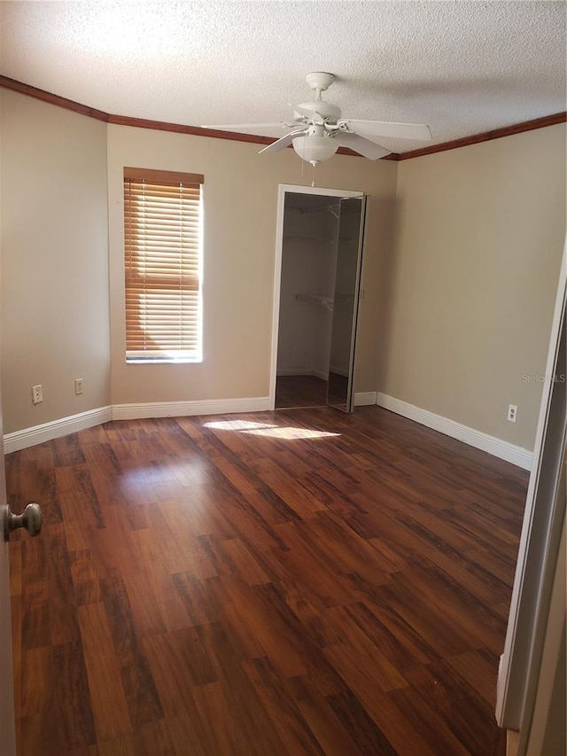 706 Lighthouse Ct, Altamonte Springs, FL 32714 - unfurnished bedroom with ornamental molding, wood finished floors, a textured ceiling, baseboards, and a closet