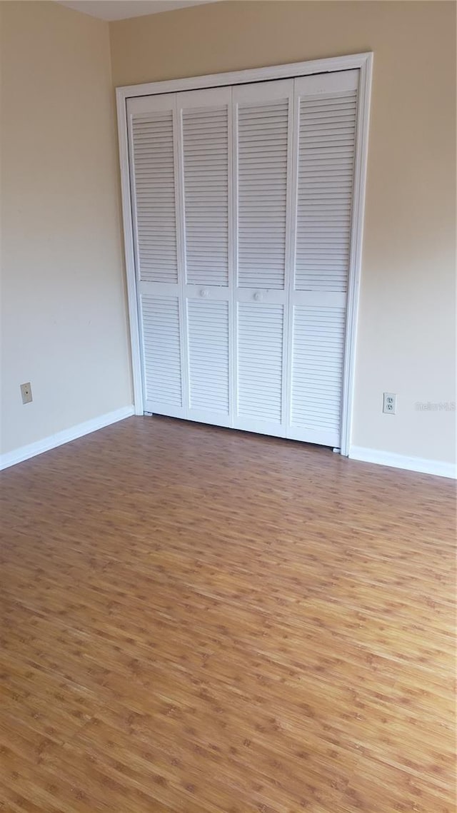 706 Lighthouse Ct, Altamonte Springs, FL 32714 - unfurnished bedroom featuring light wood-type flooring, a closet, and baseboards