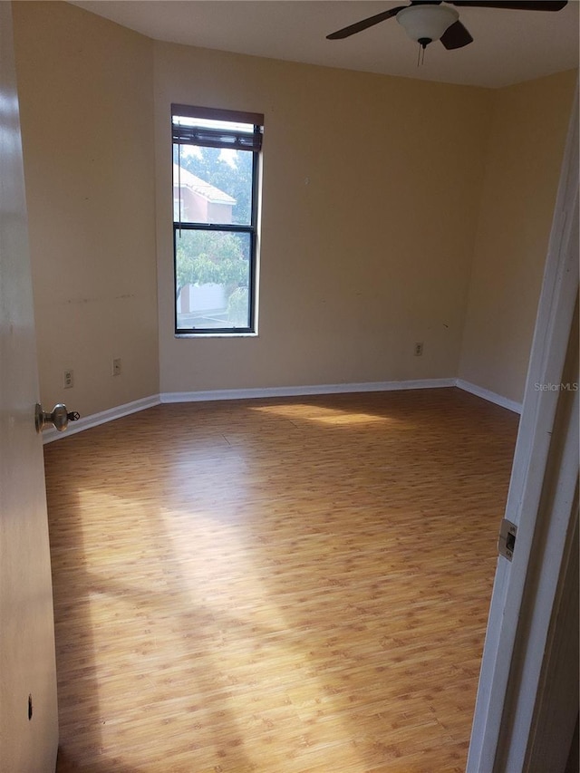 706 Lighthouse Ct, Altamonte Springs, FL 32714 - spare room with wood finished floors, a ceiling fan, and baseboards
