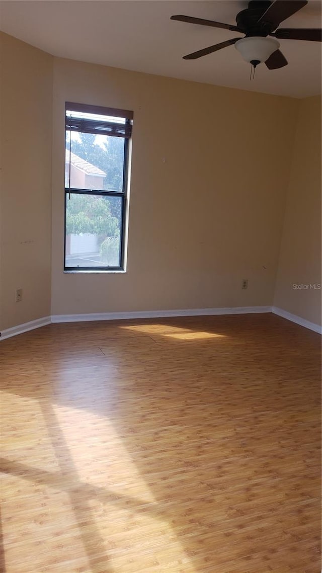 706 Lighthouse Ct, Altamonte Springs, FL 32714 - unfurnished room featuring light wood finished floors, baseboards, and ceiling fan