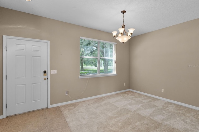 12335 Cruxbury Dr, Windermere, FL 34786 - spare room with a chandelier and light tile patterned flooring