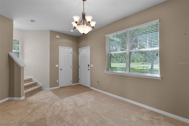 12335 Cruxbury Dr, Windermere, FL 34786 - entryway featuring carpet flooring, a chandelier, and stairway