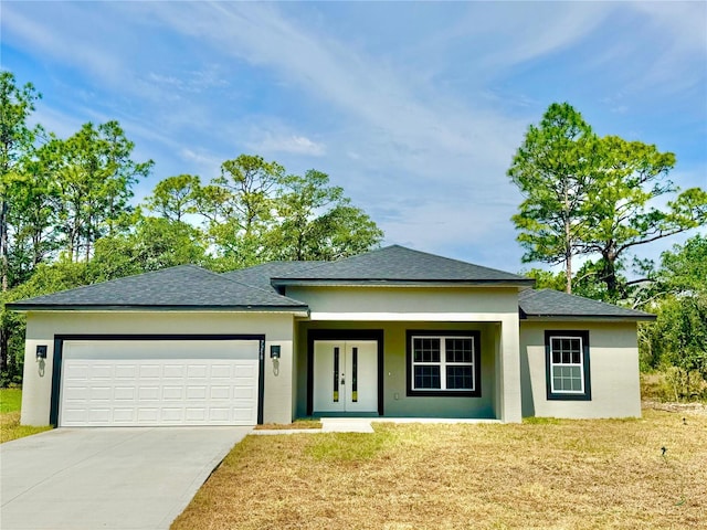 7258 N Embassy Ter, Dunnellon, FL 34434 - view of front of home featuring stucco siding, a garage, driveway, french doors, and a shingled roof