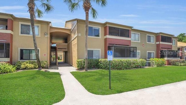 648 Kenwick Cir Unit 102, Casselberry, FL 32707 - view of building exterior with stairs