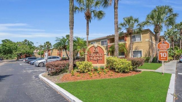 648 Kenwick Cir Unit 102, Casselberry, FL 32707 - community sign featuring uncovered parking and a yard