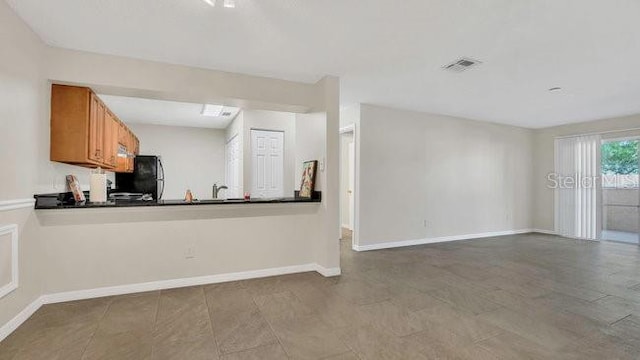 648 Kenwick Cir Unit 102, Casselberry, FL 32707 - unfurnished living room with baseboards