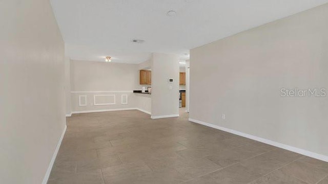 648 Kenwick Cir Unit 102, Casselberry, FL 32707 - unfurnished room featuring baseboards
