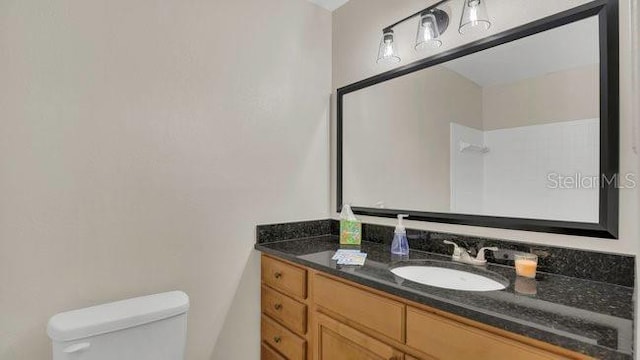 648 Kenwick Cir Unit 102, Casselberry, FL 32707 - bathroom featuring toilet and vanity