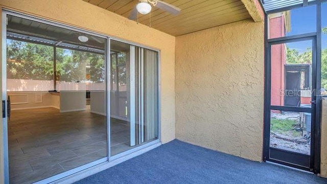 648 Kenwick Cir Unit 102, Casselberry, FL 32707 - doorway to property with stucco siding and ceiling fan
