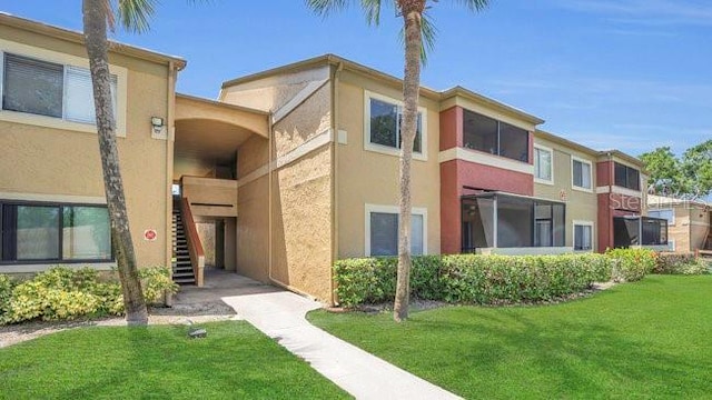 648 Kenwick Cir Unit 102, Casselberry, FL 32707 - view of building exterior with stairs