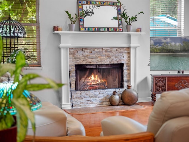 3518 Edlingham Ct, Belle Isle, FL 32812 - living area with a fireplace, wood finished floors, and plenty of natural light