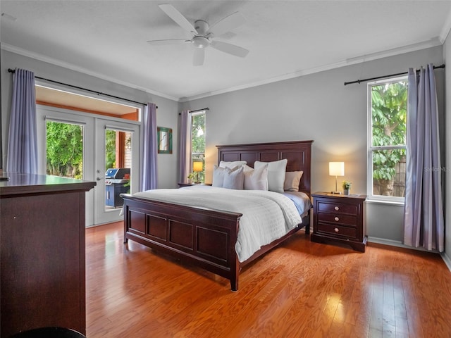 3518 Edlingham Ct, Belle Isle, FL 32812 - bedroom with crown molding, access to exterior, light wood-type flooring, french doors, and a ceiling fan