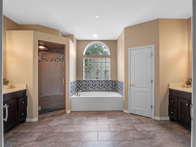 3518 Edlingham Ct, Belle Isle, FL 32812 - full bath with vanity, a bath, a shower stall, and baseboards
