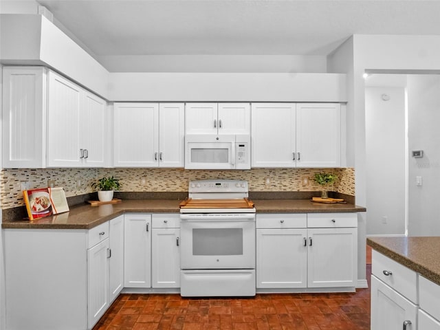 3518 Edlingham Ct, Belle Isle, FL 32812 - kitchen with white appliances, dark countertops, backsplash, and white cabinetry