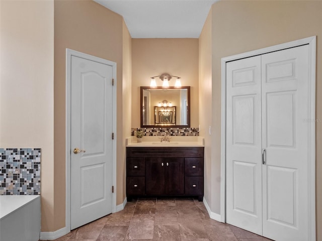 3518 Edlingham Ct, Belle Isle, FL 32812 - full bath with a closet, vanity, baseboards, and tasteful backsplash