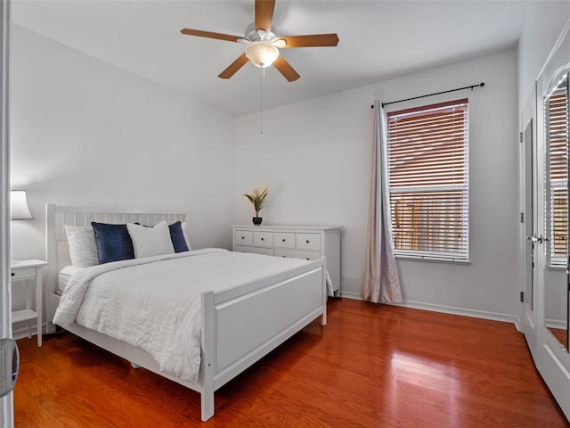3518 Edlingham Ct, Belle Isle, FL 32812 - bedroom featuring wood finished floors, a ceiling fan, and baseboards