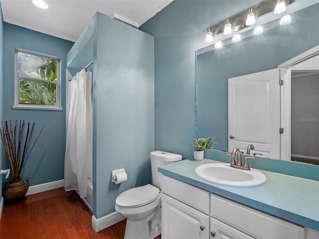 3518 Edlingham Ct, Belle Isle, FL 32812 - full bathroom with vanity, wood finished floors, toilet, and baseboards