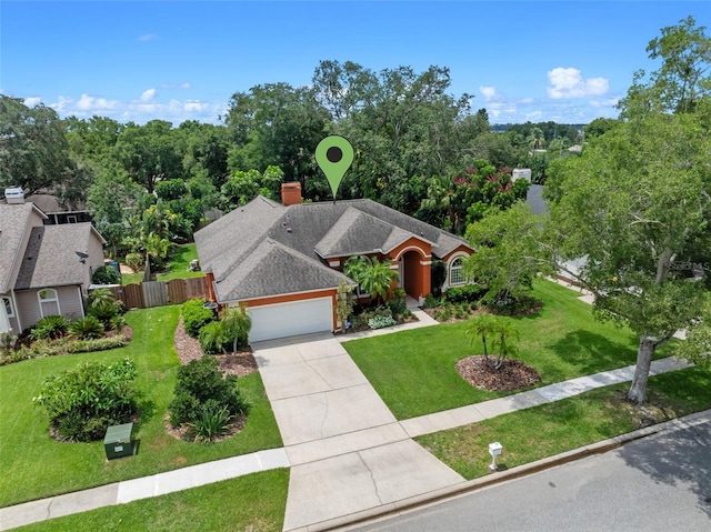 3518 Edlingham Ct, Belle Isle, FL 32812 - ranch-style home with concrete driveway, a garage, and a chimney