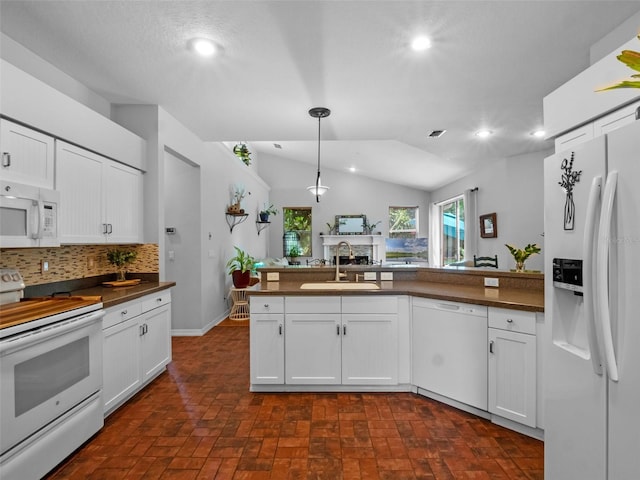 3518 Edlingham Ct, Belle Isle, FL 32812 - kitchen with white appliances, a sink, dark countertops, decorative backsplash, and recessed lighting