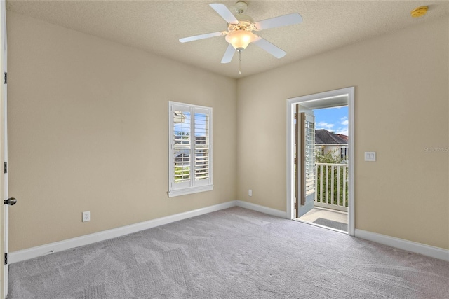 5303 Brady Ln, Orlando, FL 32814 - carpeted empty room with a smoke detector, a ceiling fan, baseboards, and a textured ceiling