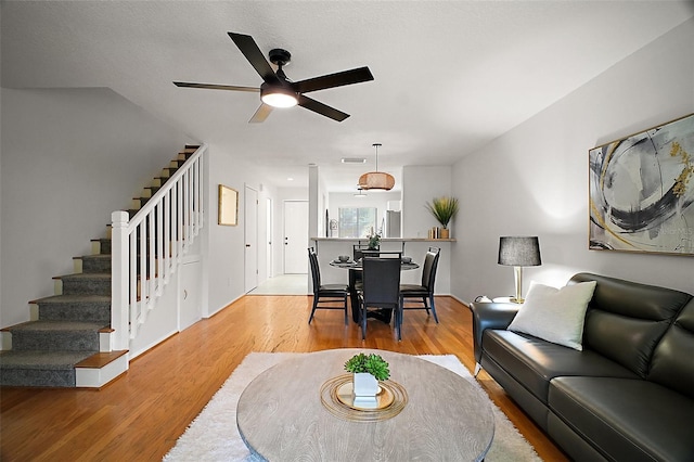 184 Sandlewood Trl Unit 2, Winter Park, FL 32789 - living area featuring stairway, a ceiling fan, and wood finished floors