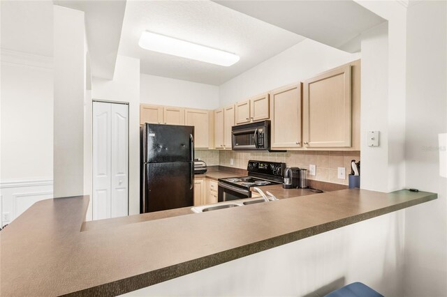 12837 Madison Pointe Cir Unit 206, Orlando, FL 32821 - kitchen featuring black appliances, decorative backsplash, dark countertops, light brown cabinets, and a peninsula