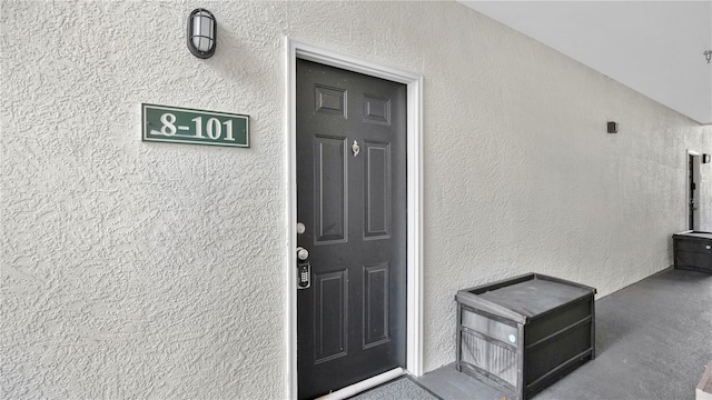 2627 Maitland Crossing Way Unit 101, Orlando, FL 32810 - doorway to property featuring stucco siding