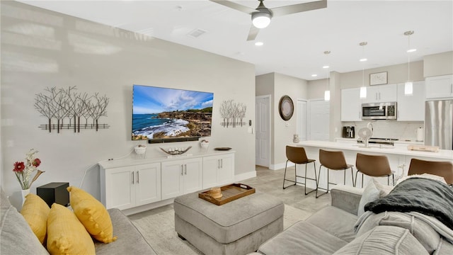 2627 Maitland Crossing Way Unit 101, Orlando, FL 32810 - living room featuring baseboards, ceiling fan, and recessed lighting