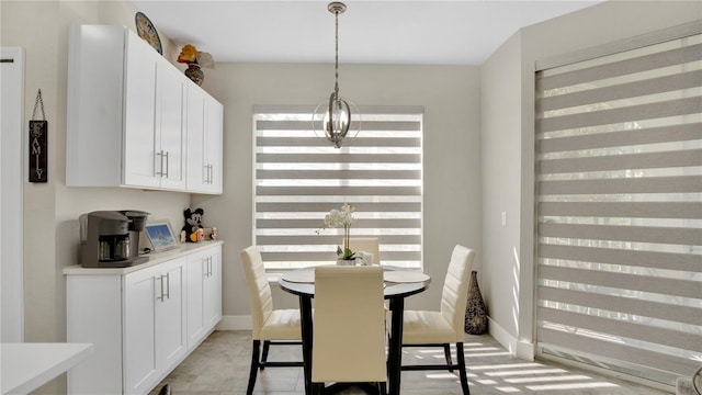 2627 Maitland Crossing Way Unit 101, Orlando, FL 32810 - dining room featuring baseboards