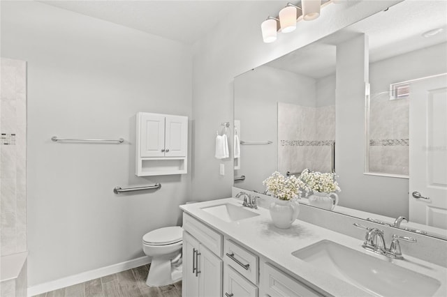 5641 Oak Knoll Dr, Saint Cloud, FL 34771 - full bath with double vanity, toilet, and tiled shower