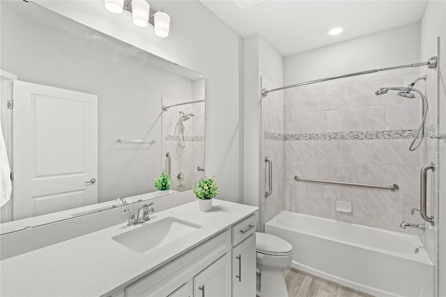 5641 Oak Knoll Dr, Saint Cloud, FL 34771 - full bathroom with vanity, shower / bath combination, toilet, and wood finished floors