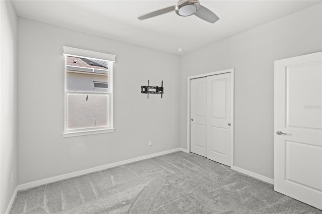 5641 Oak Knoll Dr, Saint Cloud, FL 34771 - unfurnished bedroom featuring carpet, a closet, and baseboards