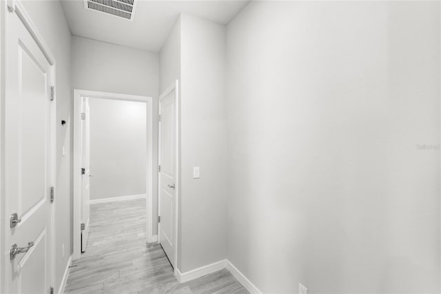 5641 Oak Knoll Dr, Saint Cloud, FL 34771 - hall featuring light wood-type flooring and baseboards