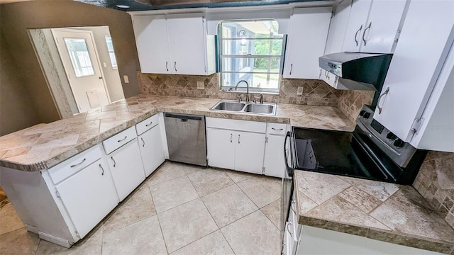 2928 NE 14th Ave, Ocala, FL 34479 - kitchen featuring stainless steel appliances, a sink, a peninsula, and plenty of natural light