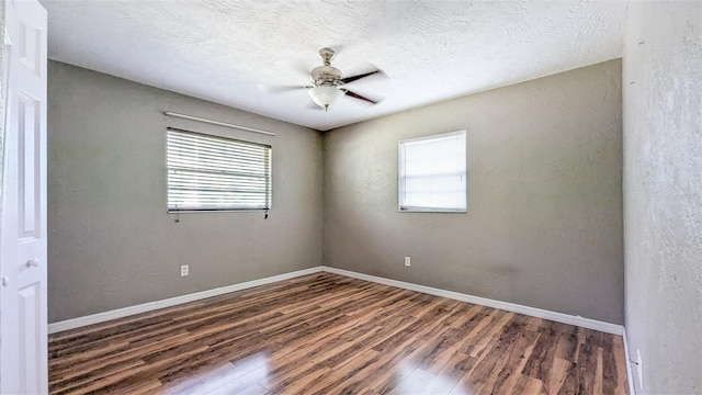 2928 NE 14th Ave, Ocala, FL 34479 - unfurnished room with wood finished floors, a ceiling fan, and baseboards