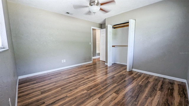 2928 NE 14th Ave, Ocala, FL 34479 - unfurnished bedroom with wood finished floors, baseboards, ceiling fan, a closet, and a textured wall