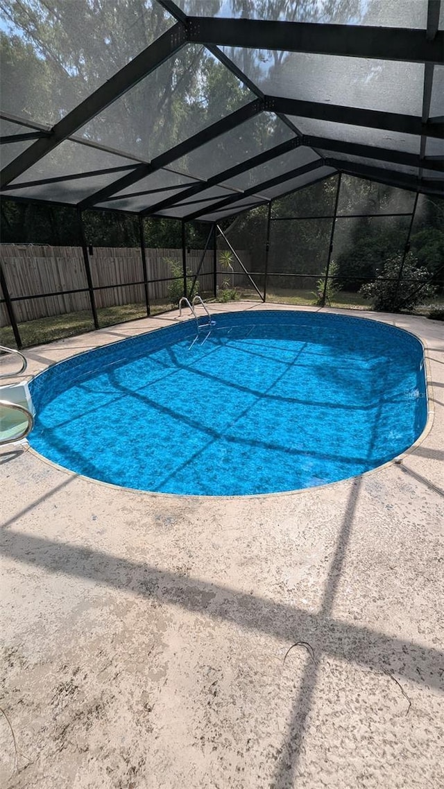 2928 NE 14th Ave, Ocala, FL 34479 - view of swimming pool with a fenced backyard, a patio area, and a lanai