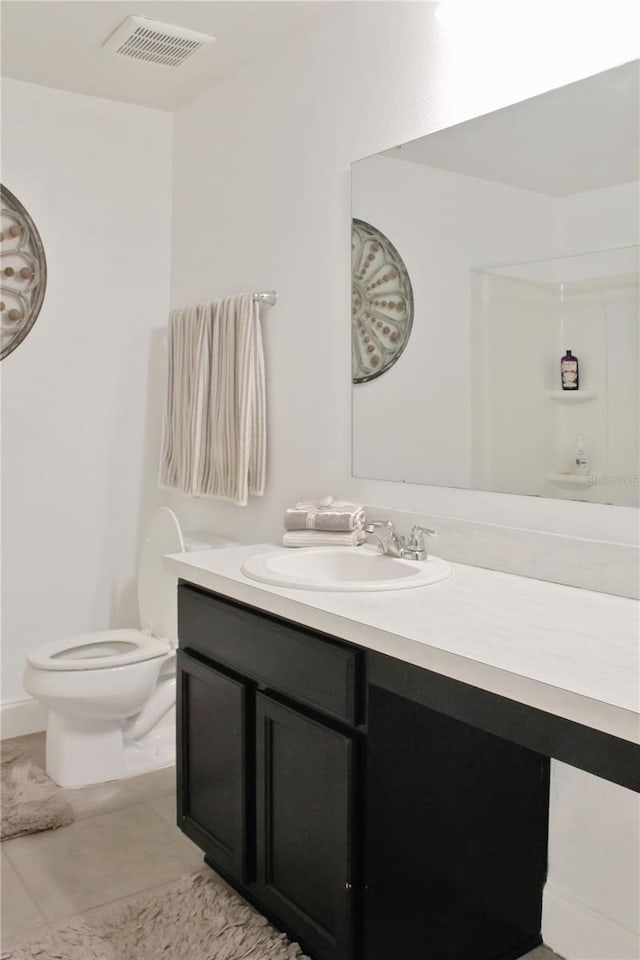 2835 Mosshire Cir, Saint Cloud, FL 34772 - bathroom with vanity, toilet, and tile patterned floors